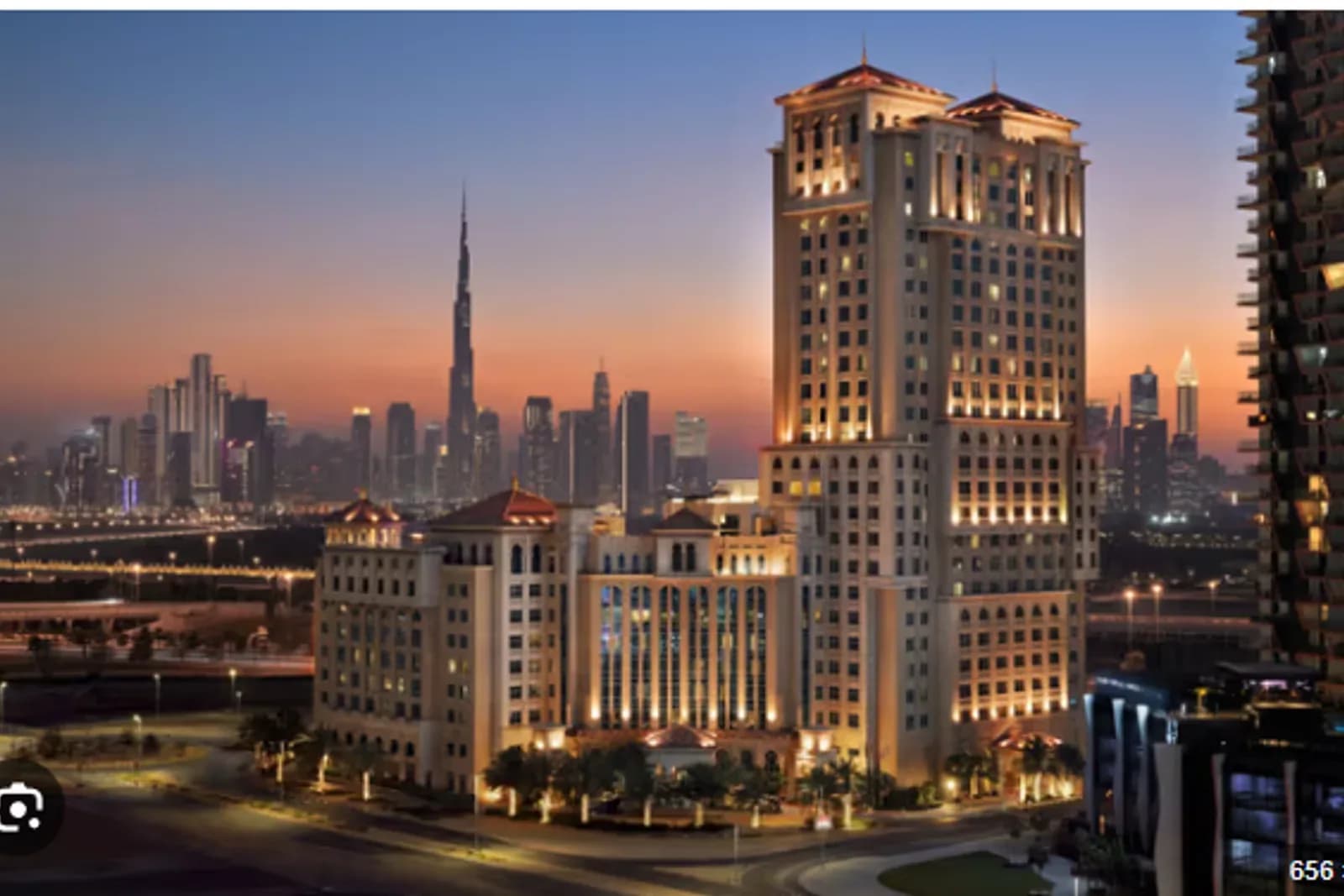 Al Jaddaf waterfront towers at dusk with the Dubai skyline behind